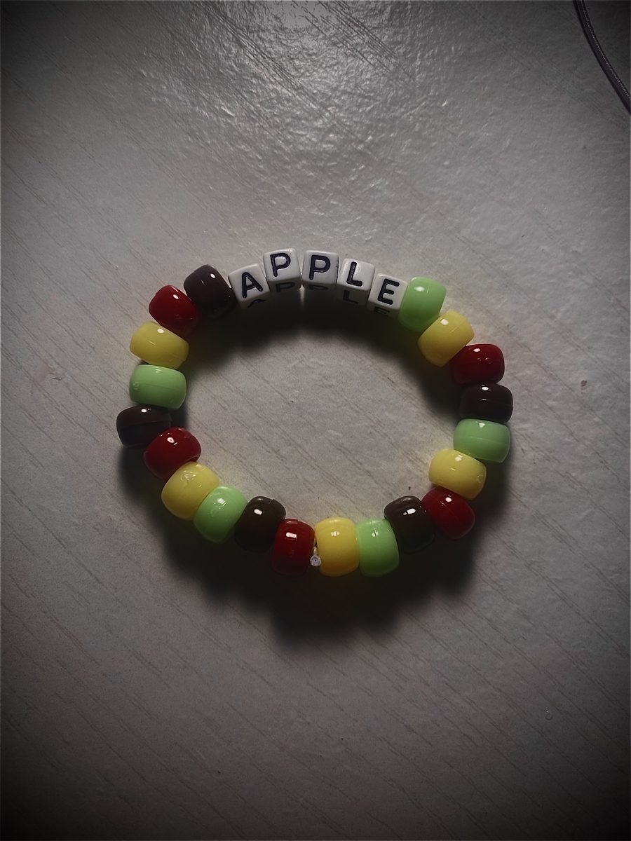 Beaded bracelet spelling APPLE in bright letter beads